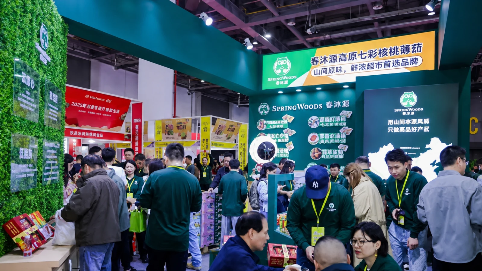 Visitors exploring a branded fruit exhibitor booth at a previous iFresh expo